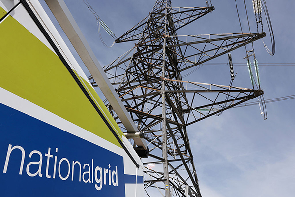 National Grid van beside a pylon, Getty