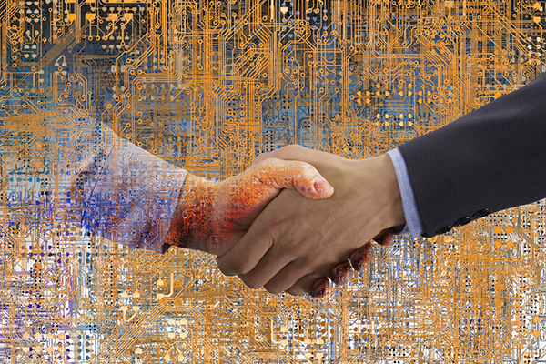 Two hands shaking against circuit board backdrop suggesting connection