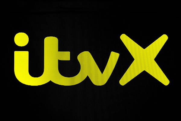 Yellow ITV logo against black background, Getty