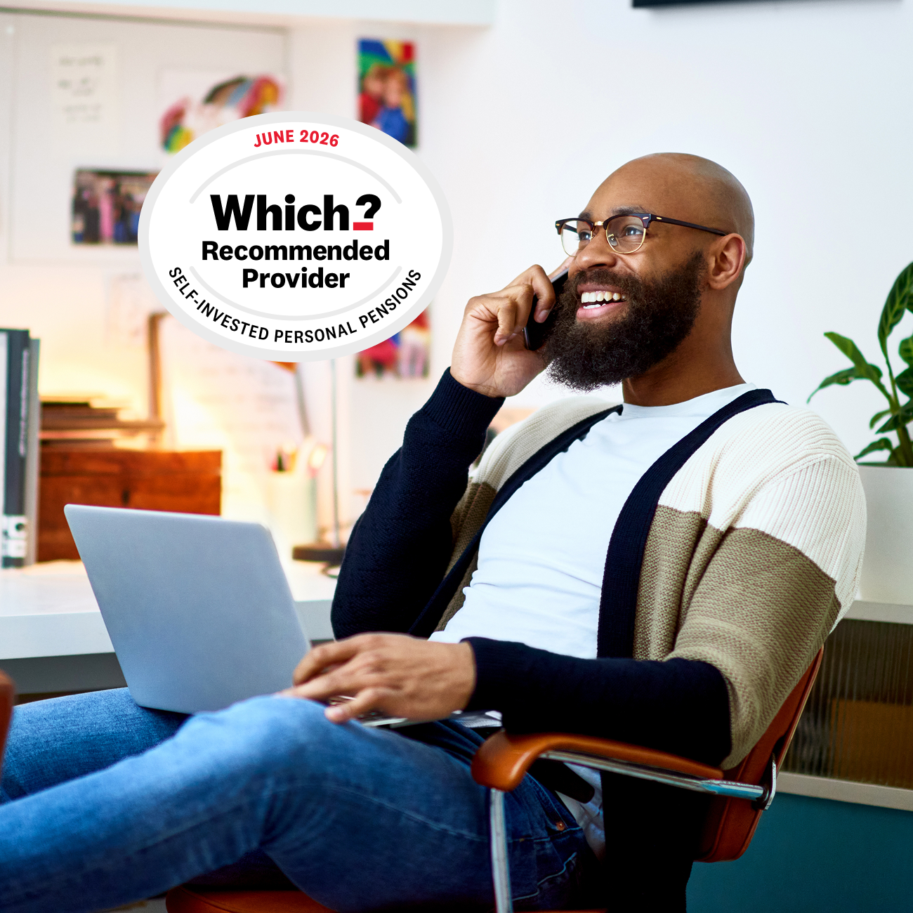 Man in home office on the phone with laptop and 2026 Which? Recommended Provider award