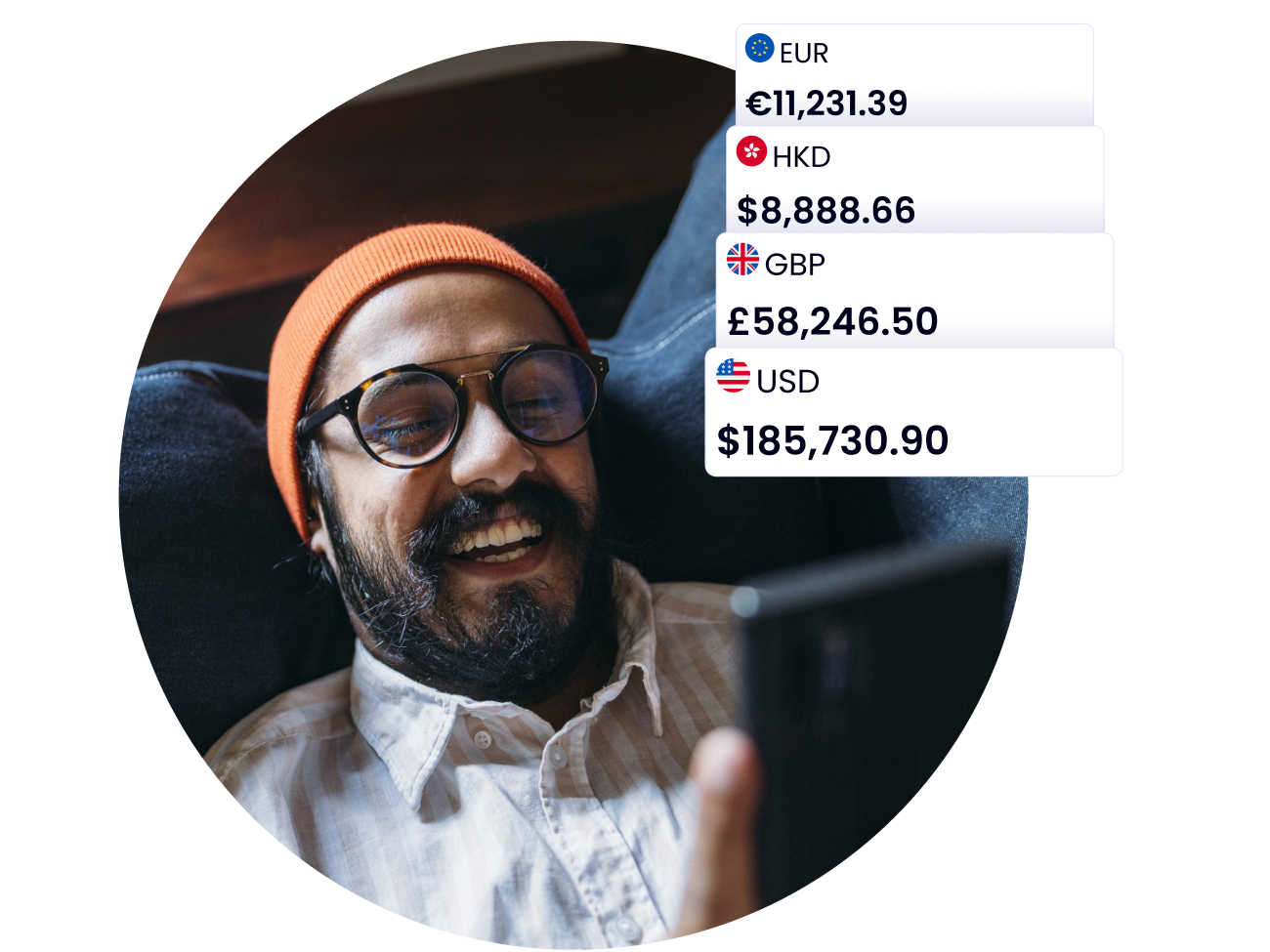 Man laying on sofa smiling at his mobile with graphics showing multi-currency figures