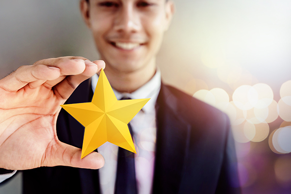 Fund manager holding a yellow star