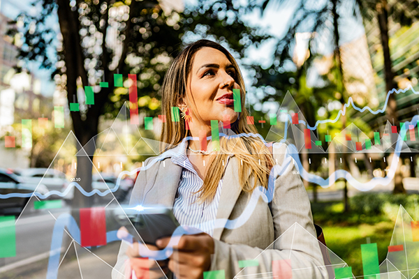 Investor looking at share on phone with graph overlay
