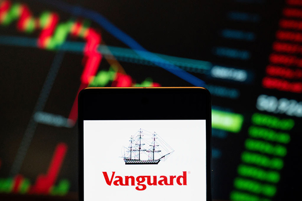 Vanguard logo against a trading screen