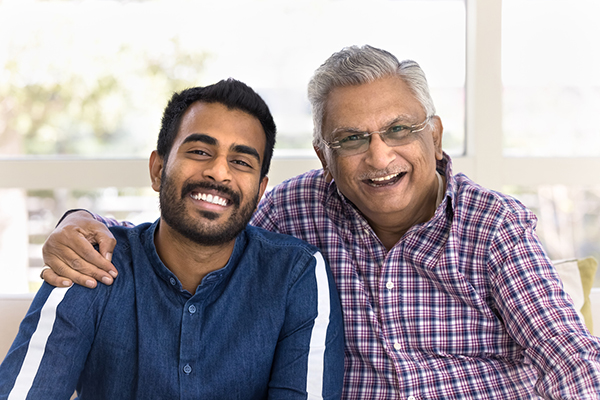 Father and son smiling