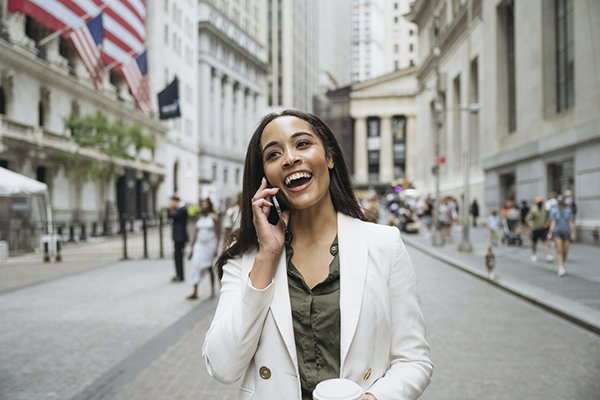 Woman smiling on Wall Street