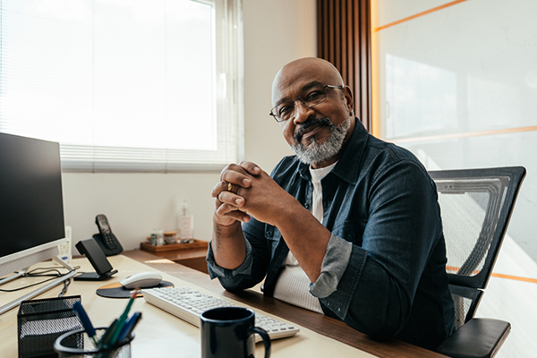 Investor sat behind desk thinking
