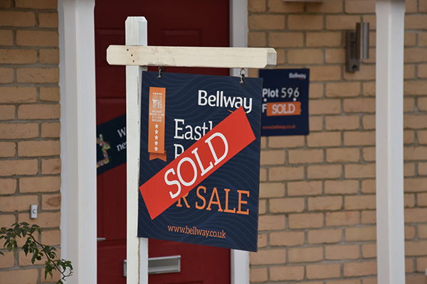 Bellway sold sign on housing development, Getty