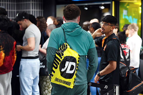 Youth with JD Sports bag, Getty