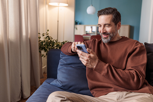 A man looking at a stock on his smartphone