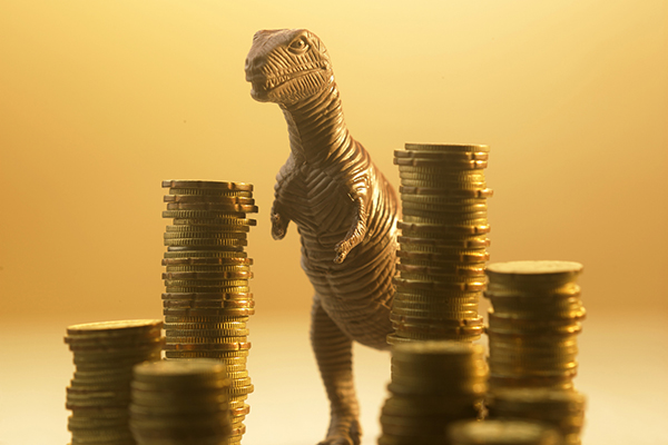 Monster with gold coins representing dividend payouts