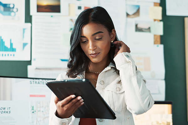 Female investor considering buying share