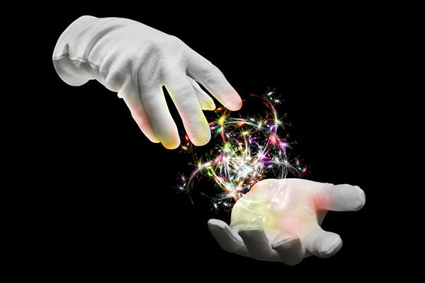 The hands of a magician conjuring magic spell