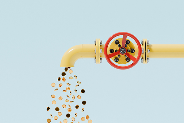 Coins representing dividend payments coming out of a pipe, Getty