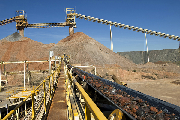 Conveyor belt transports ore to a crusher at a gold and copper mine