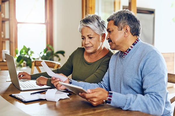 Middle-aged couple discussing finances