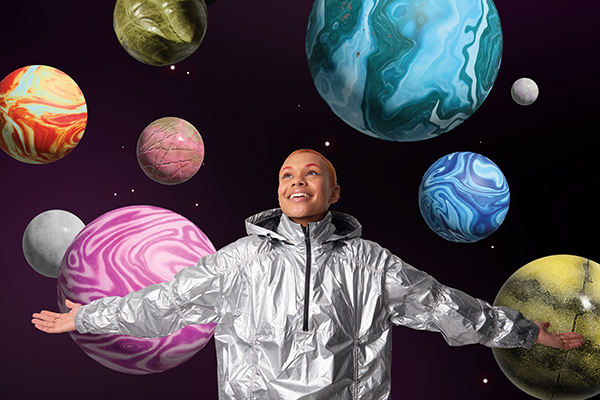An investor surrounded by planetary satellites, Getty