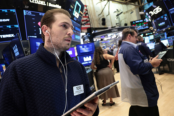 Traders on floor of NYSE, Getty